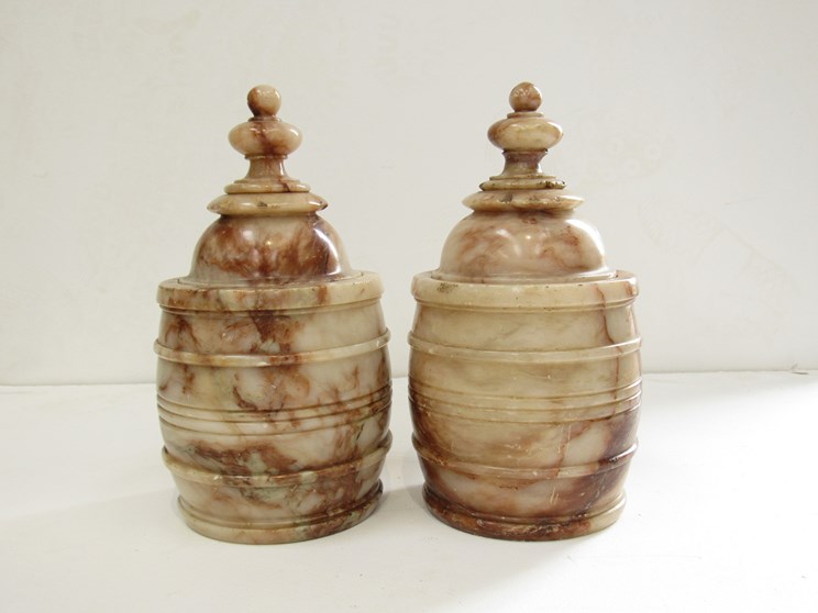 A near pair of 19th Century Alabaster lidded urns of barrel form, 26.