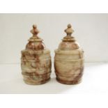 A near pair of 19th Century Alabaster lidded urns of barrel form, 26.