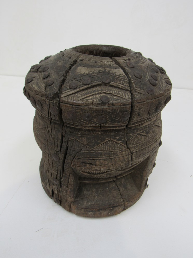 A late 19th Century carved African Mortar with wrought metal studding approximately 22cm tall, - Image 2 of 2