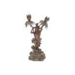 A 19th Century treen figural group of Native women and child walking through foliage with snake at