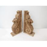 A pair of 19th Century carved pine corbels with scroll and acanthus styling,