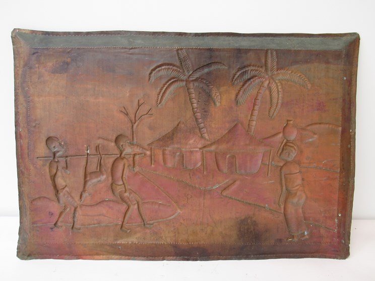 A hammered copper plaque depicting African hunters returning to village. - Image 3 of 3