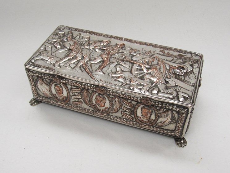 A WWI silver plated commemorative cigarette/ jewellery box embossed with design by R.