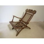 A late 19th Century Anglo-Indian folding reclining bergère chair with bone and ivory inlaid