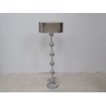 An early 20th Century American chrome and plated floor lamp with six ball and rod column,