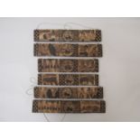 Six carved panels strung together depicting African warriors, rhino,