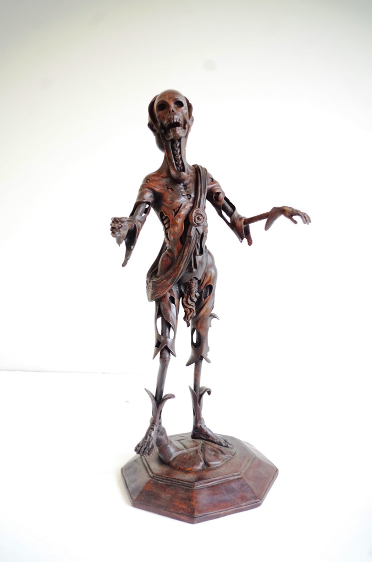 A memoir- mento macarb carved figure of a skeleton 77cm tall x base30cm wide