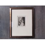 A framed and glazed etching, trial plate to test biting strength, depicting Harlequin,