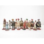 13 late 19th/early 20th Century clay figures of Indian people, dressed, varying conditions.