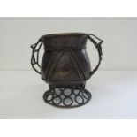 An African bronze two handled pedestal pot,