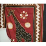 An African hand decorated wall hanging/throw depicting a giraffe