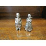 A Berthold Muller salt and pepperette of Dutchman and lady stamped 925 with import marks 10cm tall,