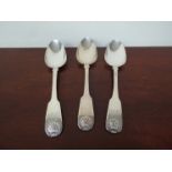 A set of three William Esterbrook silver spoons with shell design and monogram, London 1826,