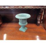 A small cast iron campagna urn