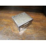 A silver cigarette box, makers mark rubbed, Chester 1925 with wood lined interior,