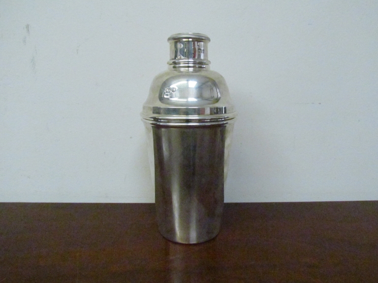 A silver cocktail shaker by Searle & Co, London 1953, 20cm tall,