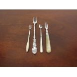 A Victorian and Edwardian silver ended pickle fork with mother of pearl handles and two plated