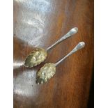 Two Georgian William Weston silver berry spoons,