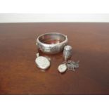 A stiff hinge silver bangle,