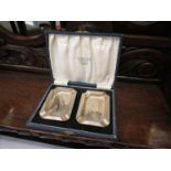 A cased pair of silver ashtrays, Birmingham 1932,