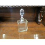 A silver collared glass perfume bottle,