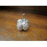 An Indian white metal embossed lidded pot as a fruit