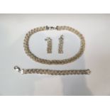 A white metal suite, necklace, earrings and bracelet, plated design,