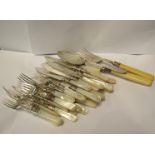 A quantity of mother-of-pearl handled tea knives and forks and fish servers