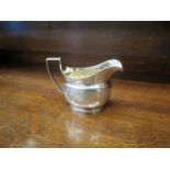 A Georgian silver engraved milk jug, London 1807,