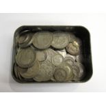 A tin containing silver coins