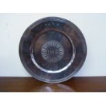 A Charles II silver plate / tazza with central sun emblem monogrammed IHS,