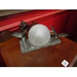 A French Art Deco table lamp, marble base, surmounted by bronze birds,