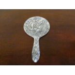 A late 19th early 20th Century Chinese silver coloured metal backed hand mirror,