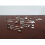 Six pairs of silver sugar tongs,