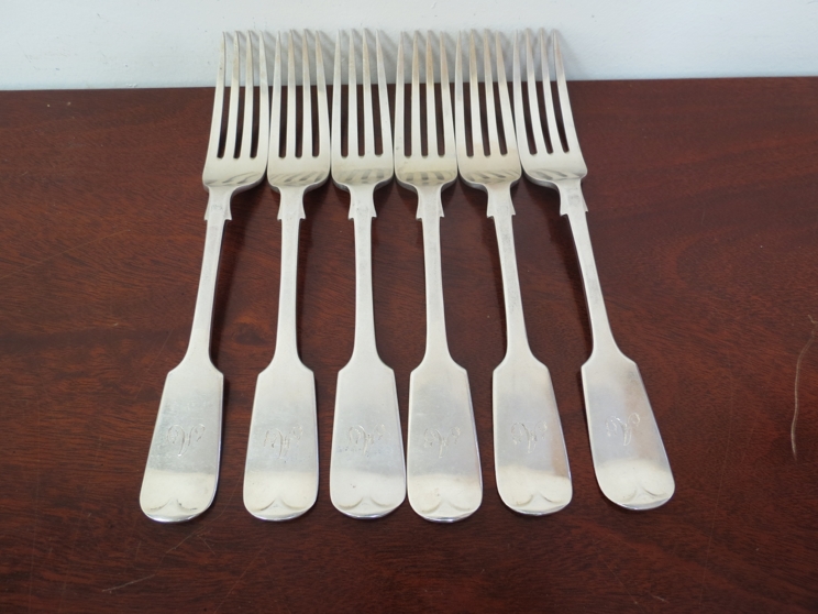 A set of six Josiah Williams and Co silver forks, London 1937, monogrammed handles,