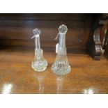 Two silver collared long neck bottles