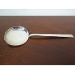 A Hilliard and Thomason silver scoop with pierced swirls, Birmingham 1924,