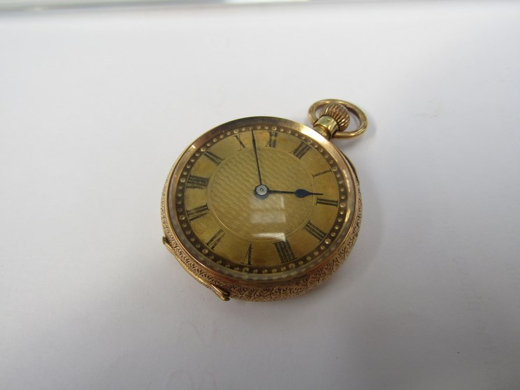 An early 20th Century 18ct gold fob watch with highly engraved decoration to case,