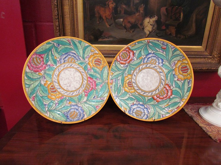 A pair of Charlotte Rhead by Crown Ducal plates/chargers,