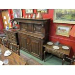 A 17th Century oak court cupboard in two pieces, two door top, two door base,