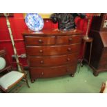 A circa 1860 flame mahogany bow front chest of two short over three graduating long drawers on