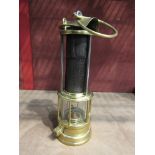 Clanny miners lamp, with flip top and gauze protected by three rods, stamped E Thomas,