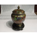 A Cloisonné lidded pot, deep blue, red and green foliate sprays,