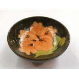 A Moorcroft Hibiscus pattern small bowl, green ground, 11.