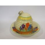 A Clarice Cliff Newport Pottery Ltd crocus design honey pot together with a Royal Staffordshire