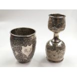 An Indian white metal shot cup and a twin headed measuring cup. 9.