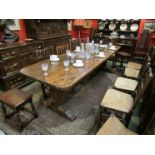 An 18th Century oak trestle table, two plank top,