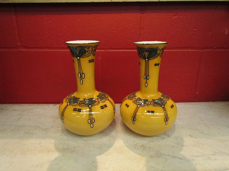 A pair of Elves Ware vases by Wood and Sons, Burslem, yellow ground with Art Nouveau green,