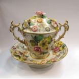 A late 18th Century English porcelain, lidded cup, saucer,