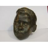 A pottery head of young boy, indistinctly signed to the base,